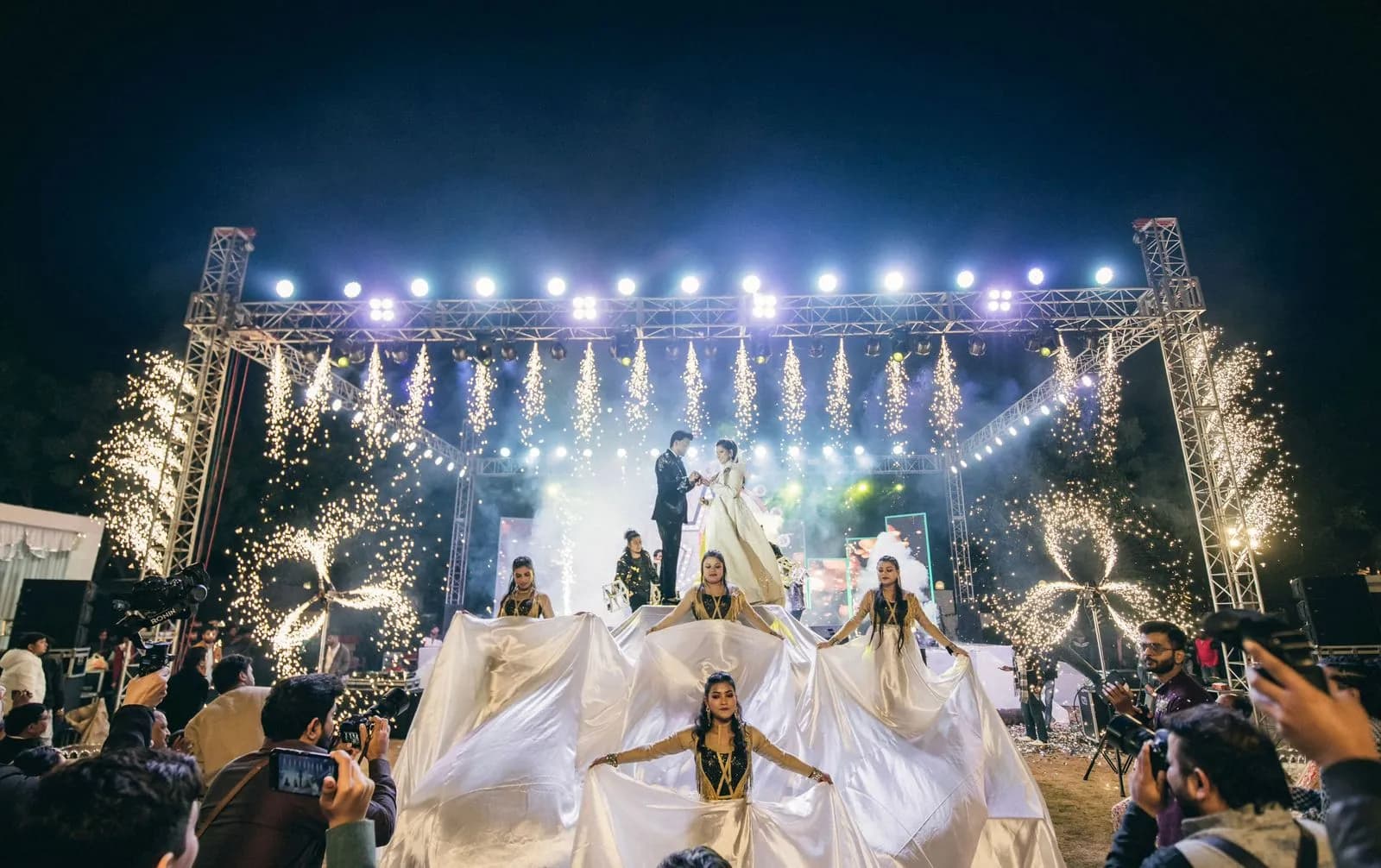 Night wedding stage in Udaipur with cold-pyro fireworks and dancers