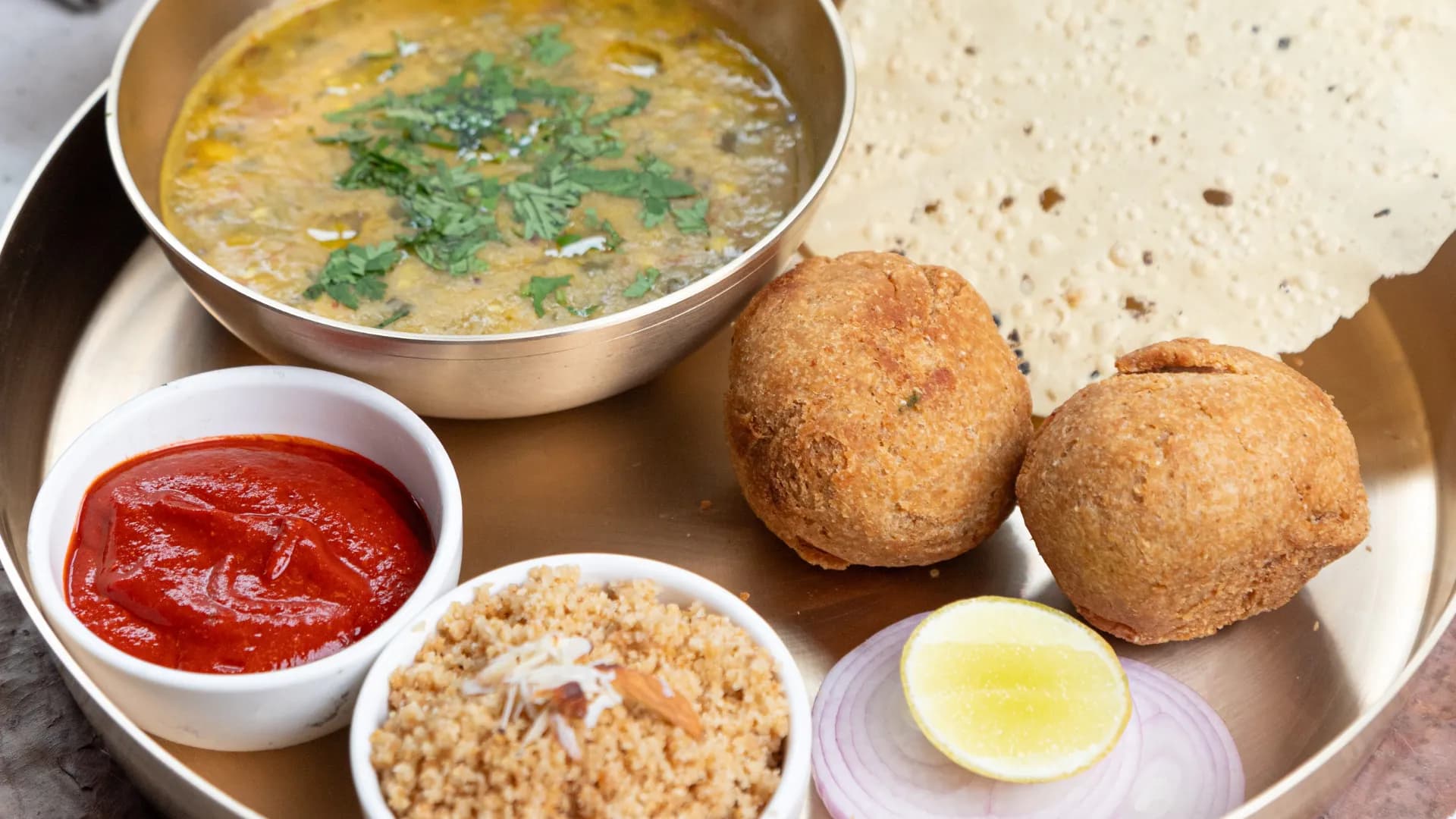 Rajasthani thali with dal, baati, churma and chutney