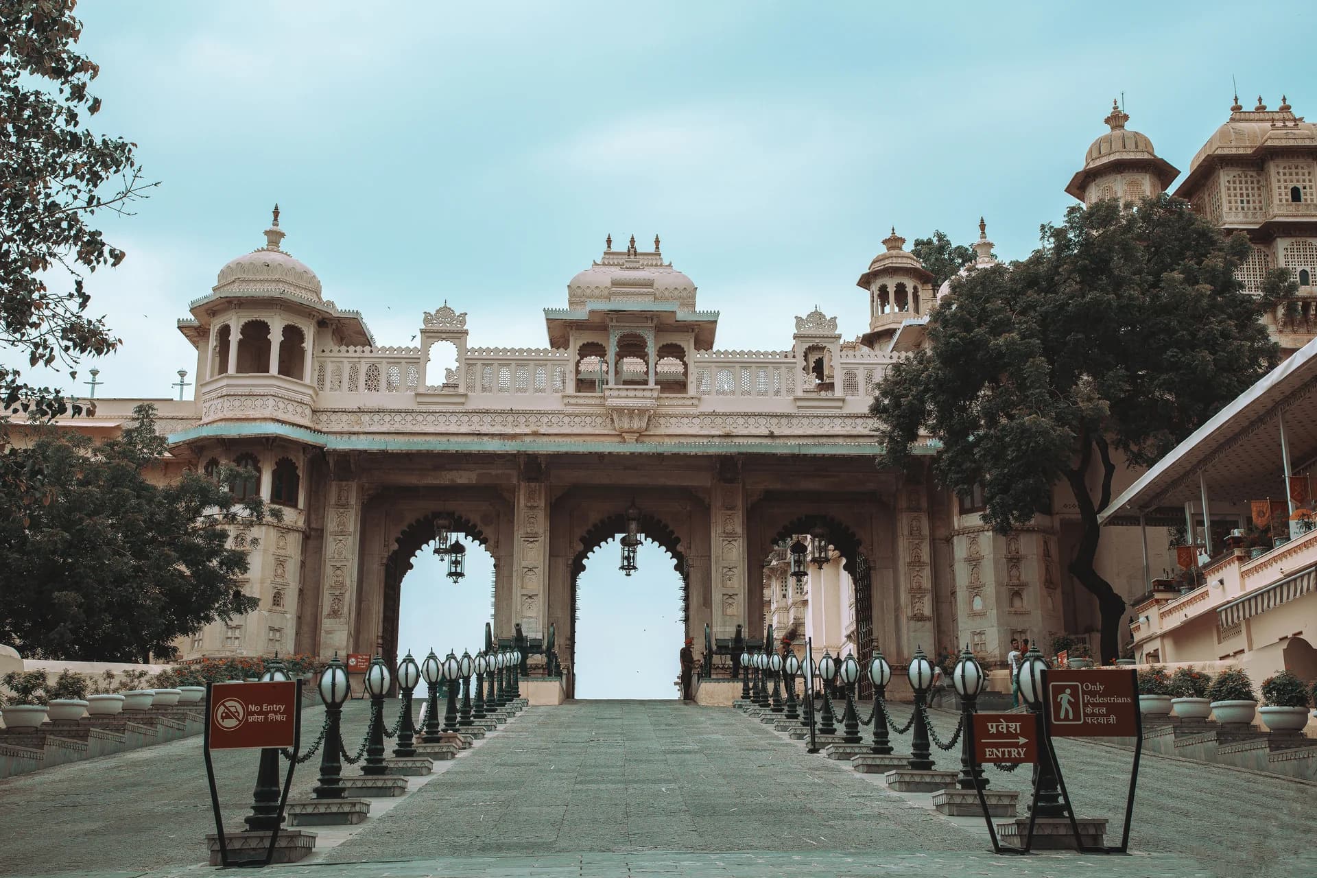 Grand palace gateway with arched entrance and lanterns
