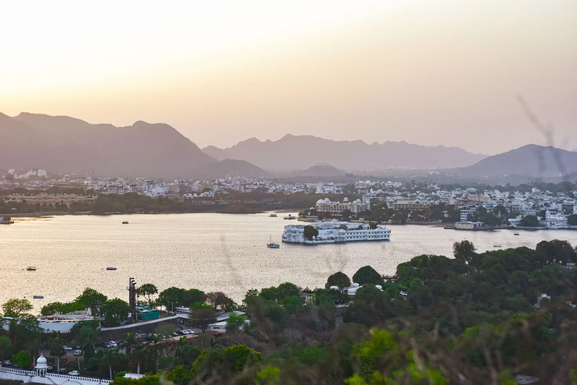 Lake Pichola and the Lake Palace at sunset seen from a height